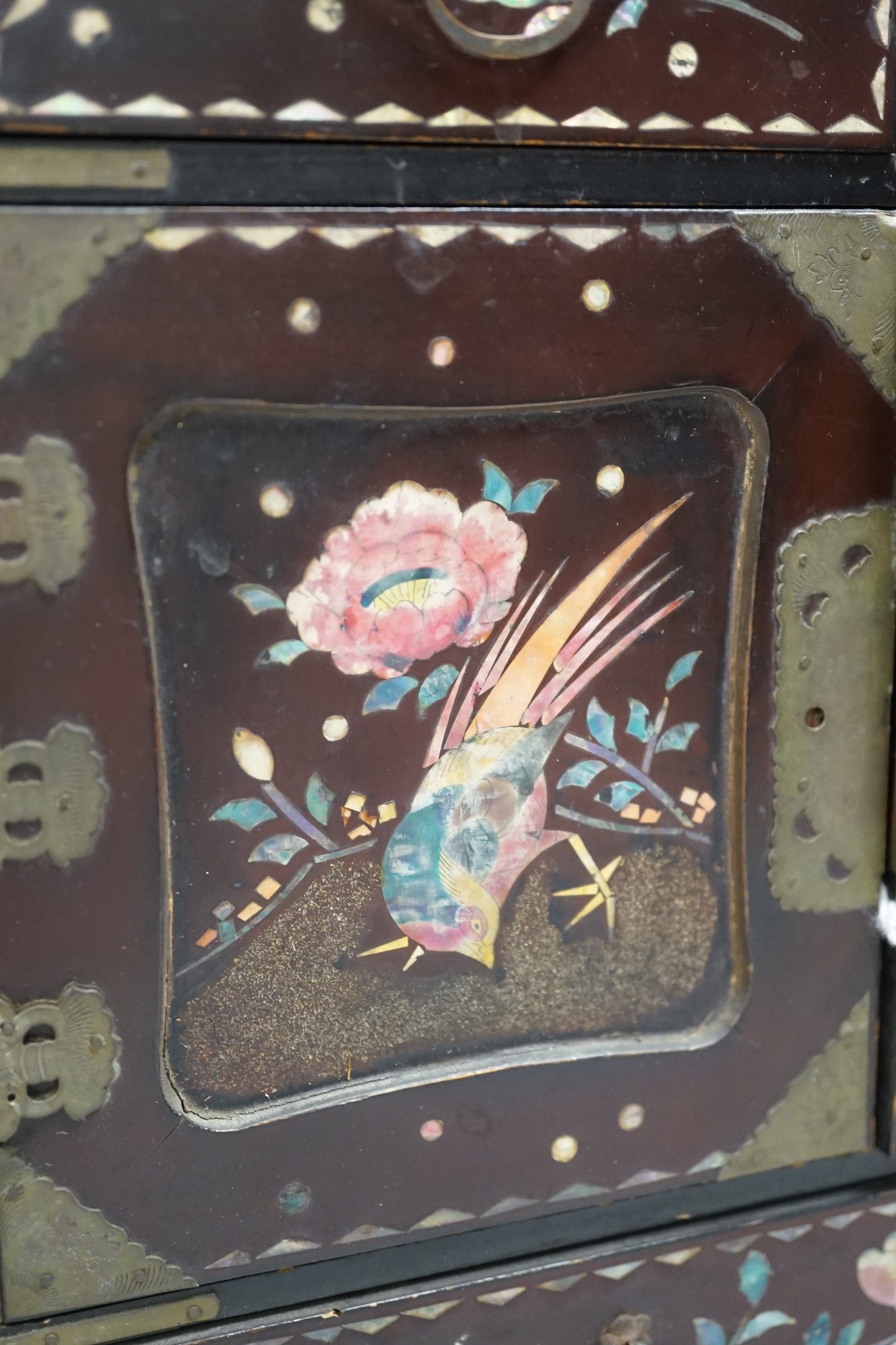A Japanese inlaid mother-of-pearl miniature chest. 36cm tall